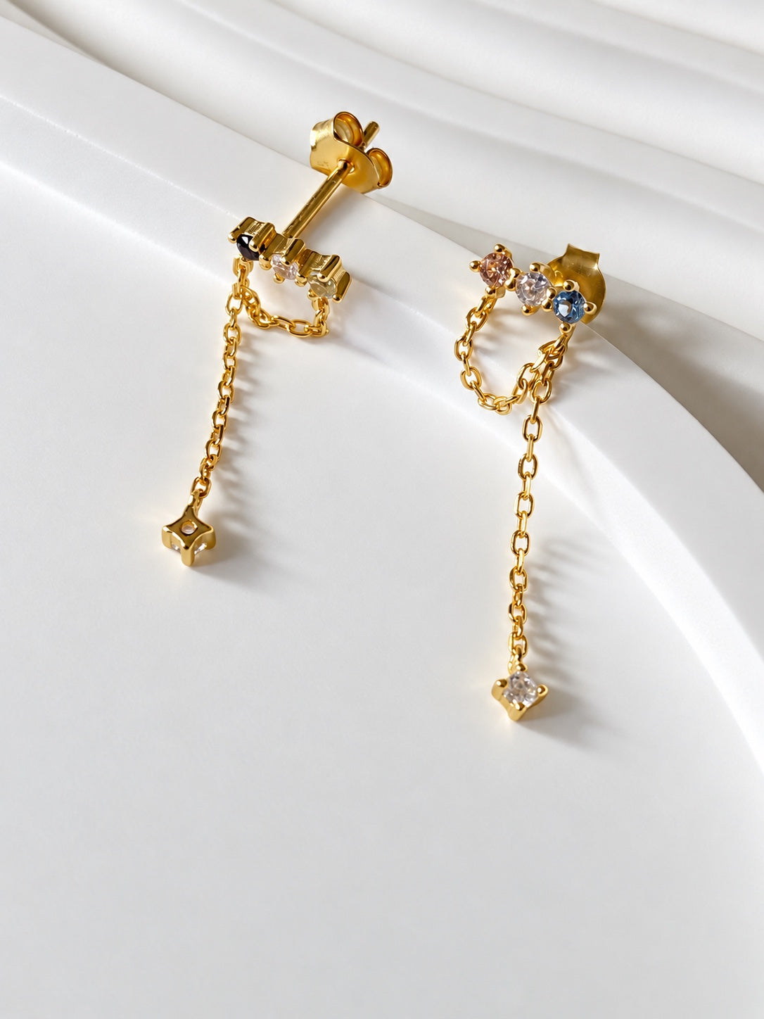 Back view of chain drop earrings showing posts and butterfly backs