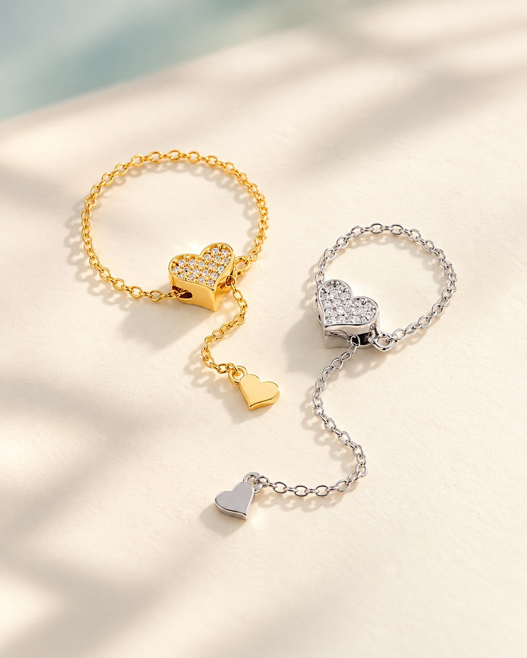 Gold and silver heart chain rings together