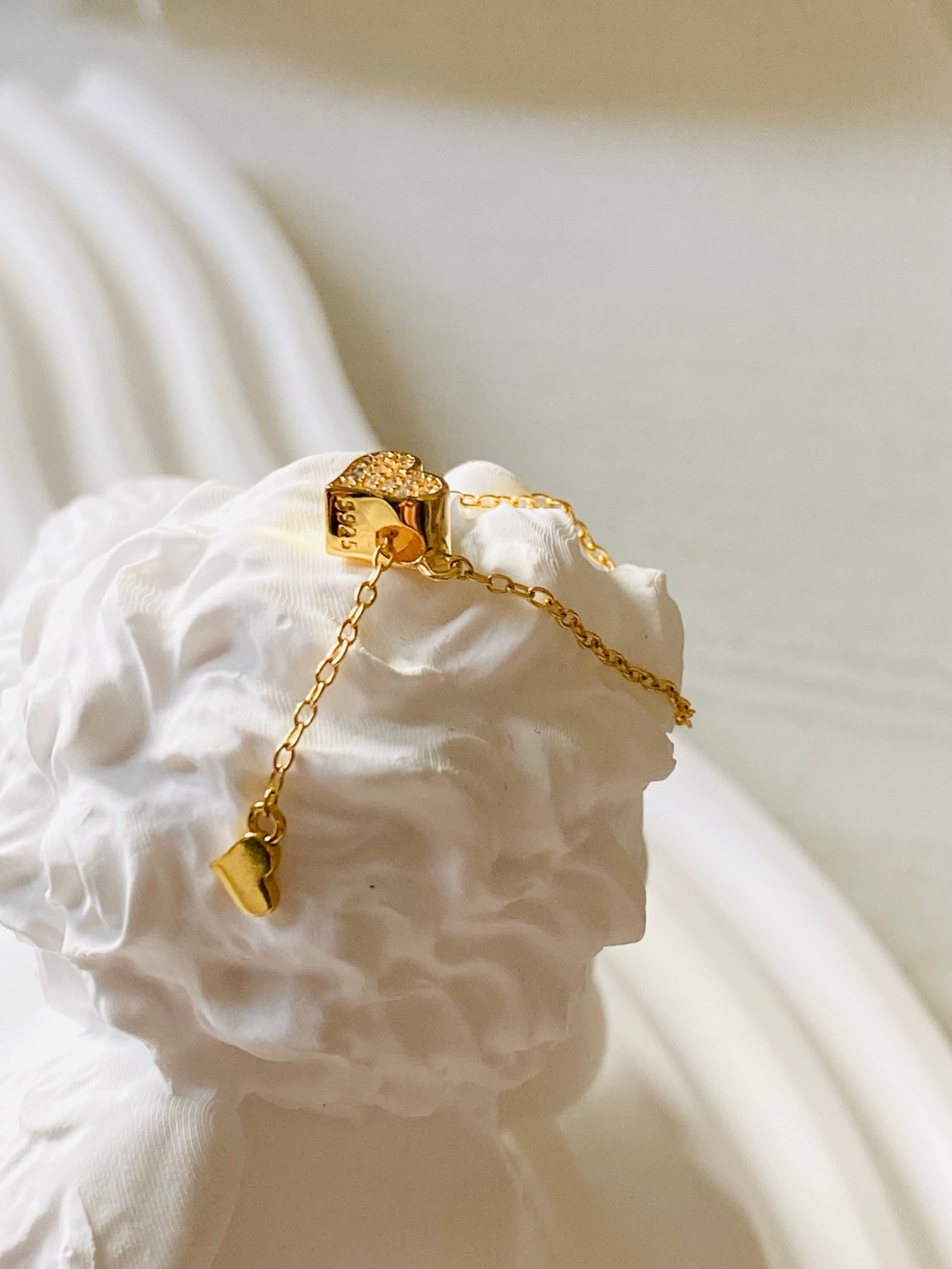 Gold heart chain ring side view showing S925 stamp